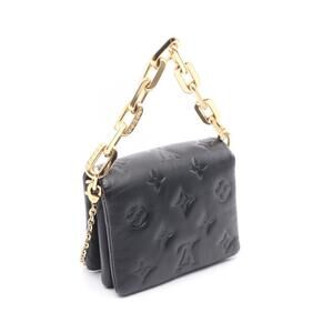 Louis Vuitton leather handbag black Coussin belt bag